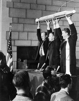 Photo of William Hayward Pickering, James Van Allen, and Wernher von Braun displaying a full-scale model of Explorer 1